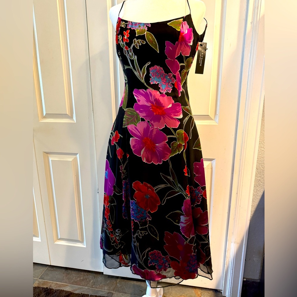 NWT….Coctail dress with tulle underneath. Never worn… vintage look. Low back.